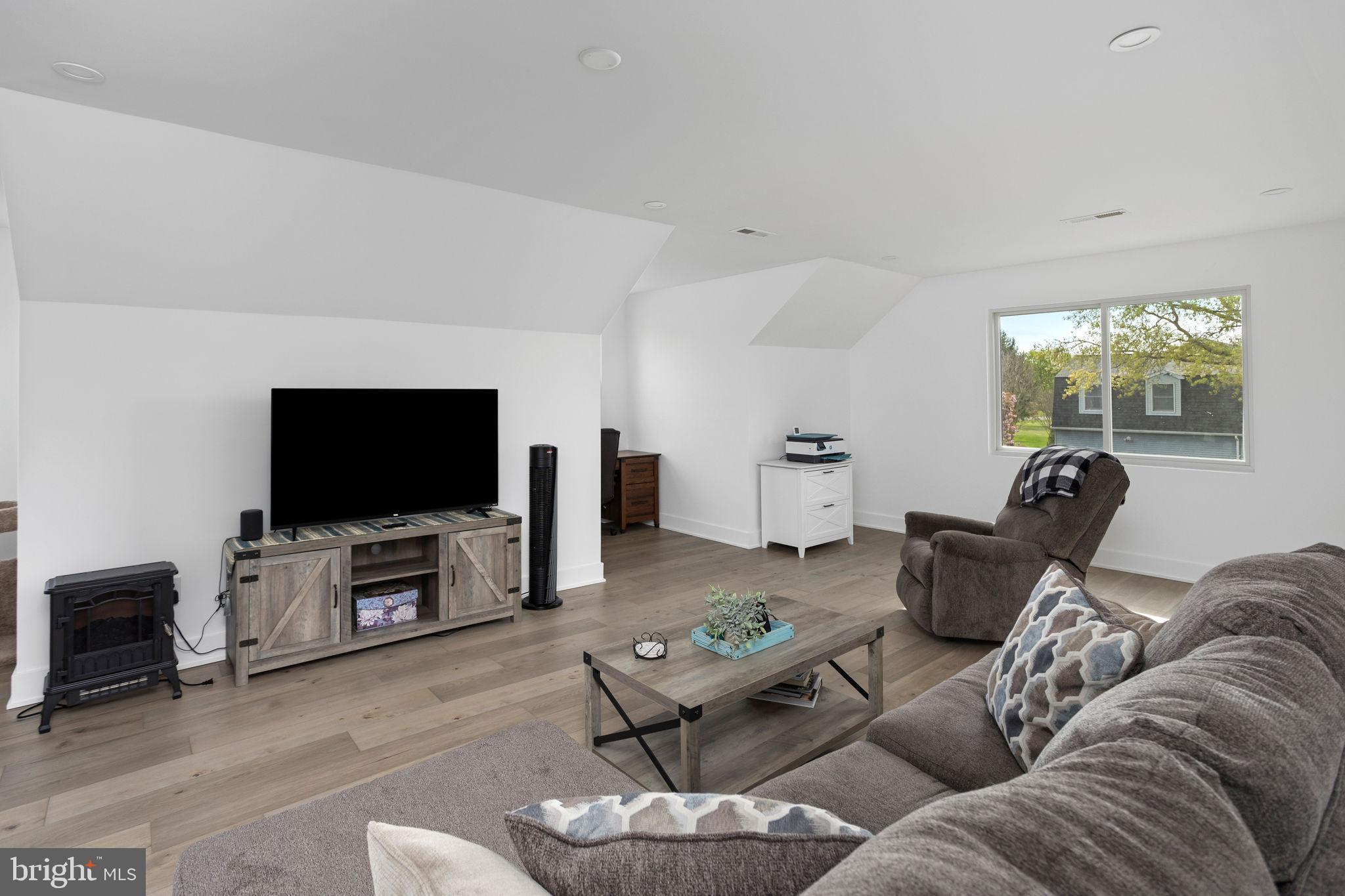 11 Bridge Road Lumberton, NJ 08048 - Photo 26 of 38 a living room with furniture and a flat screen tv