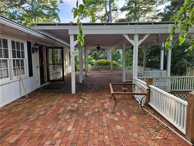 a view of a patio with a table and chairs