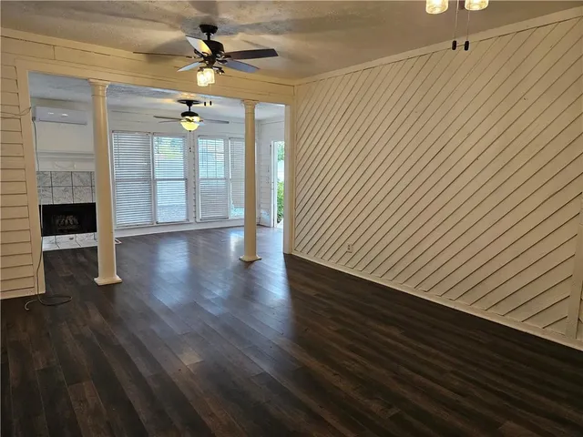wooden floor in an empty room with a window