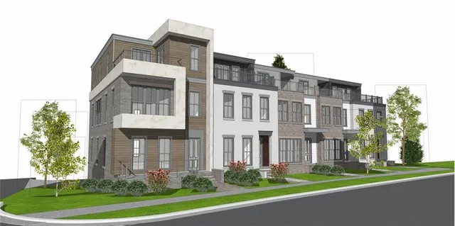 a front view of a residential apartment building with a yard and potted plants