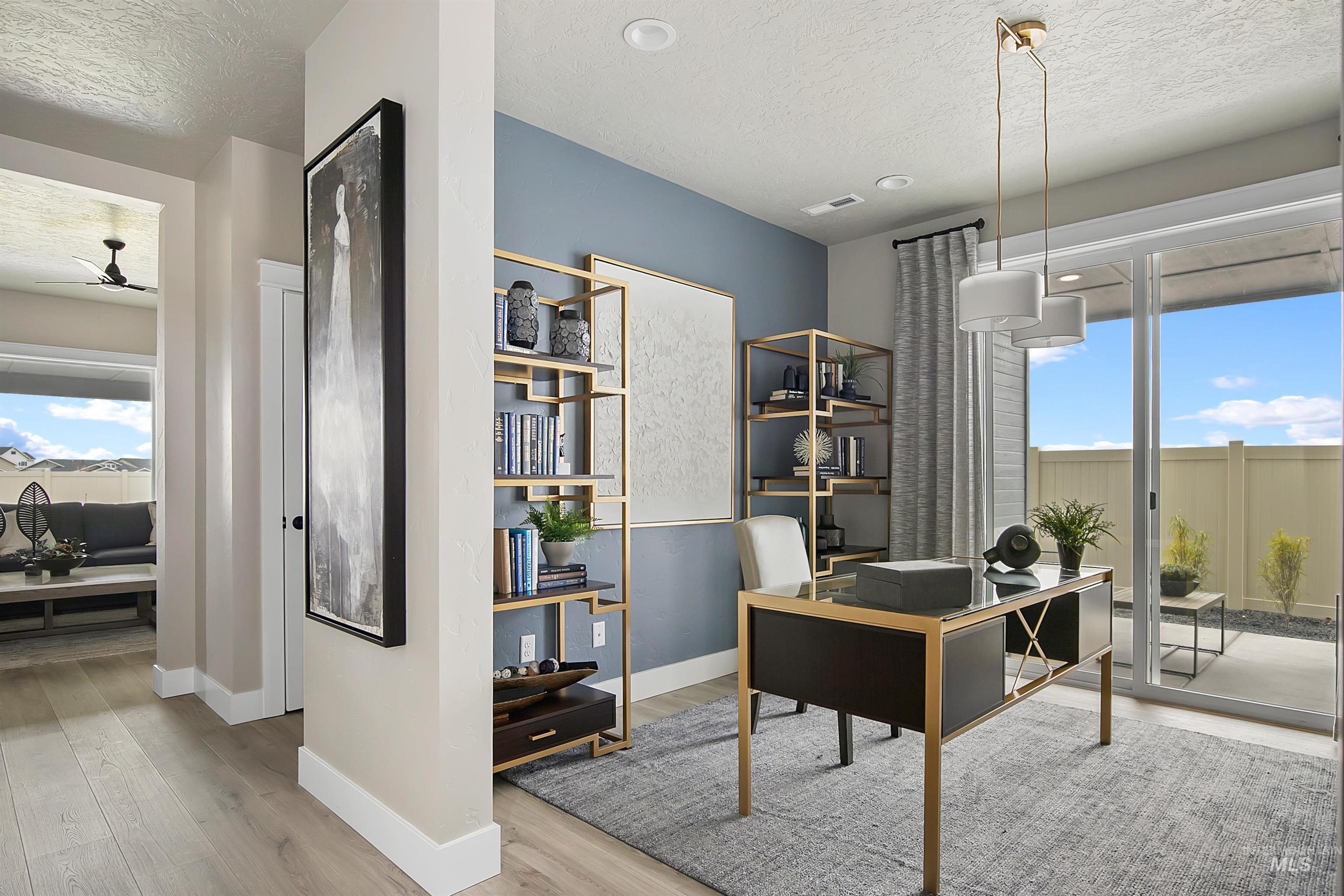 5877 West Ladle Rapids Street Meridian, ID 83646 - Photo 3 of 11 Office with a textured ceiling, light wood-type flooring, and ceiling fan