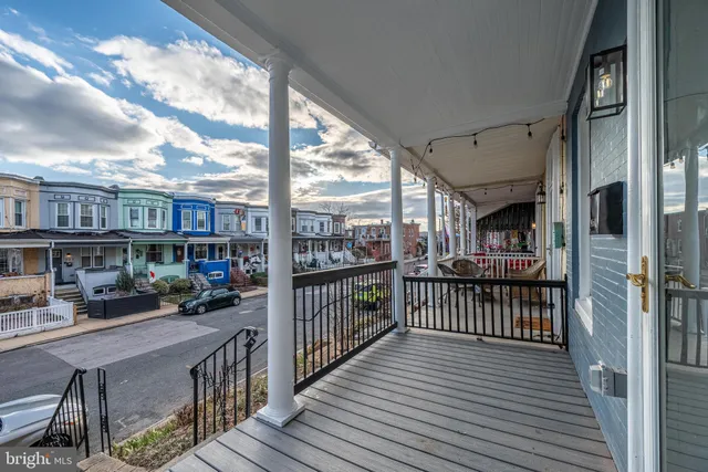 a view of a porch with wooden floor