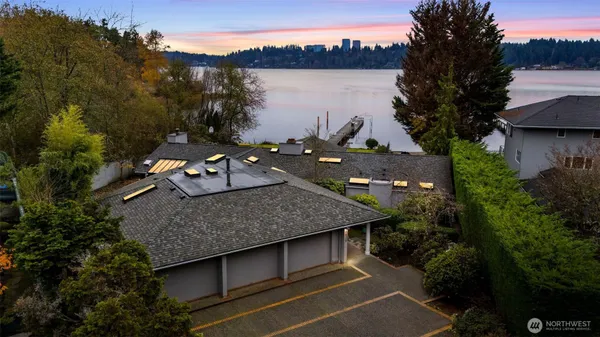 an aerial view of a house with lake view