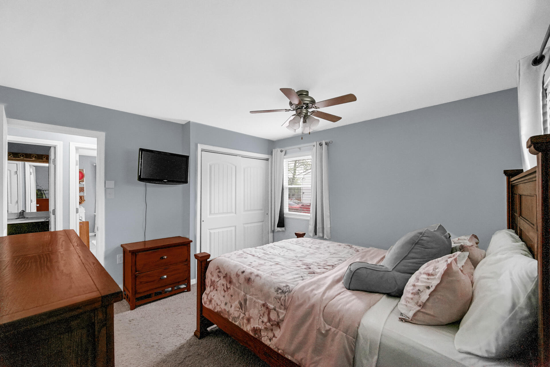 705 Juniper Road Valparaiso, IN 46385 - Photo 11 of 21 a bedroom with a bed and a flat screen tv
