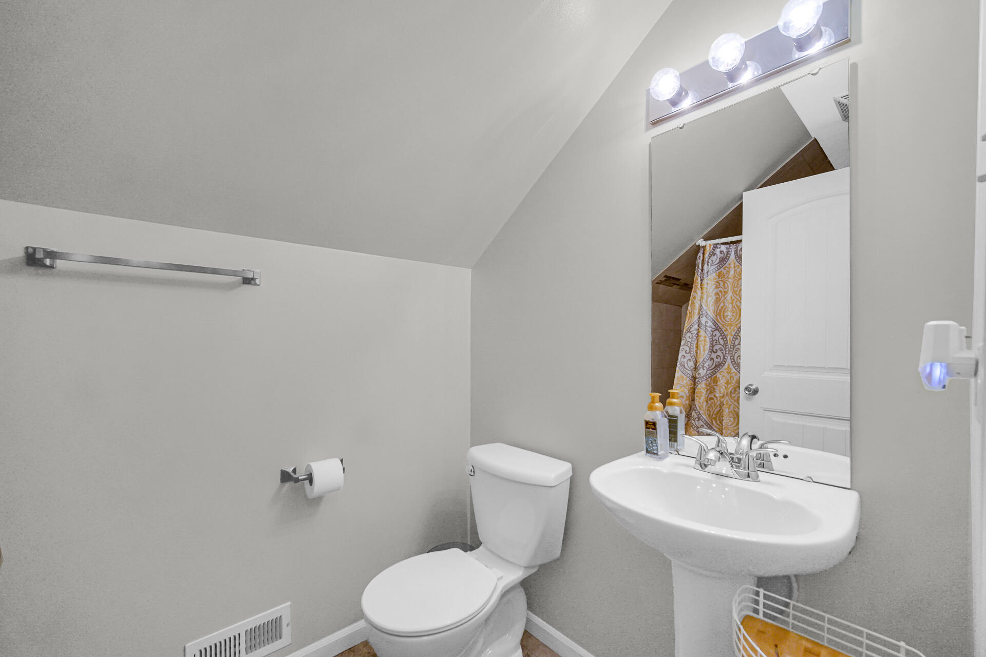 705 Juniper Road Valparaiso, IN 46385 - Photo 15 of 21 a bathroom with a toilet a sink and mirror