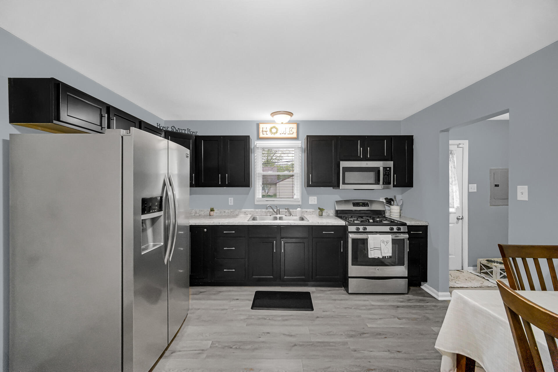 705 Juniper Road Valparaiso, IN 46385 - Photo 6 of 21 a kitchen with stainless steel appliances a stove a refrigerator and a microwave