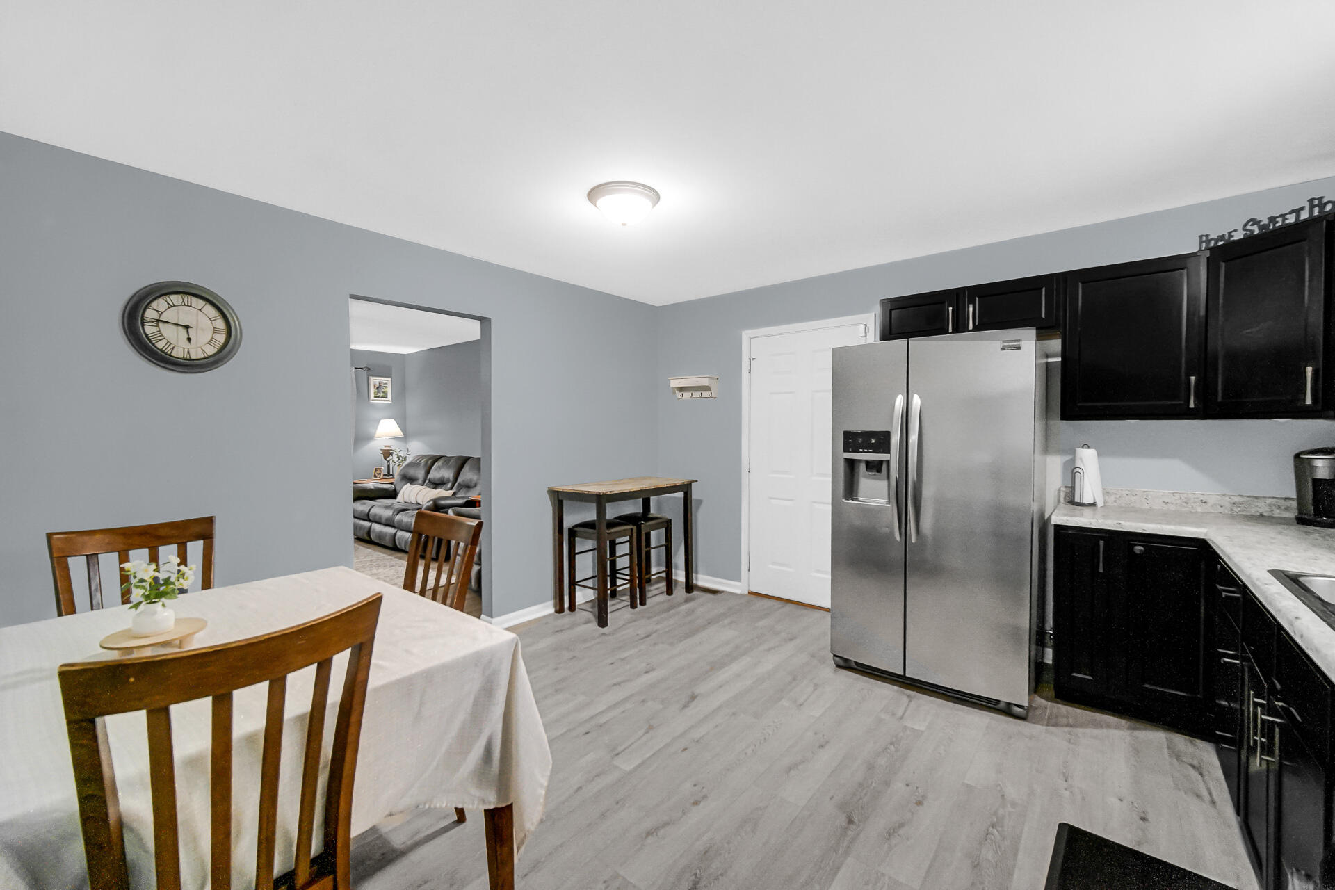 705 Juniper Road Valparaiso, IN 46385 - Photo 7 of 21 a kitchen with stainless steel appliances a refrigerator and a stove top oven