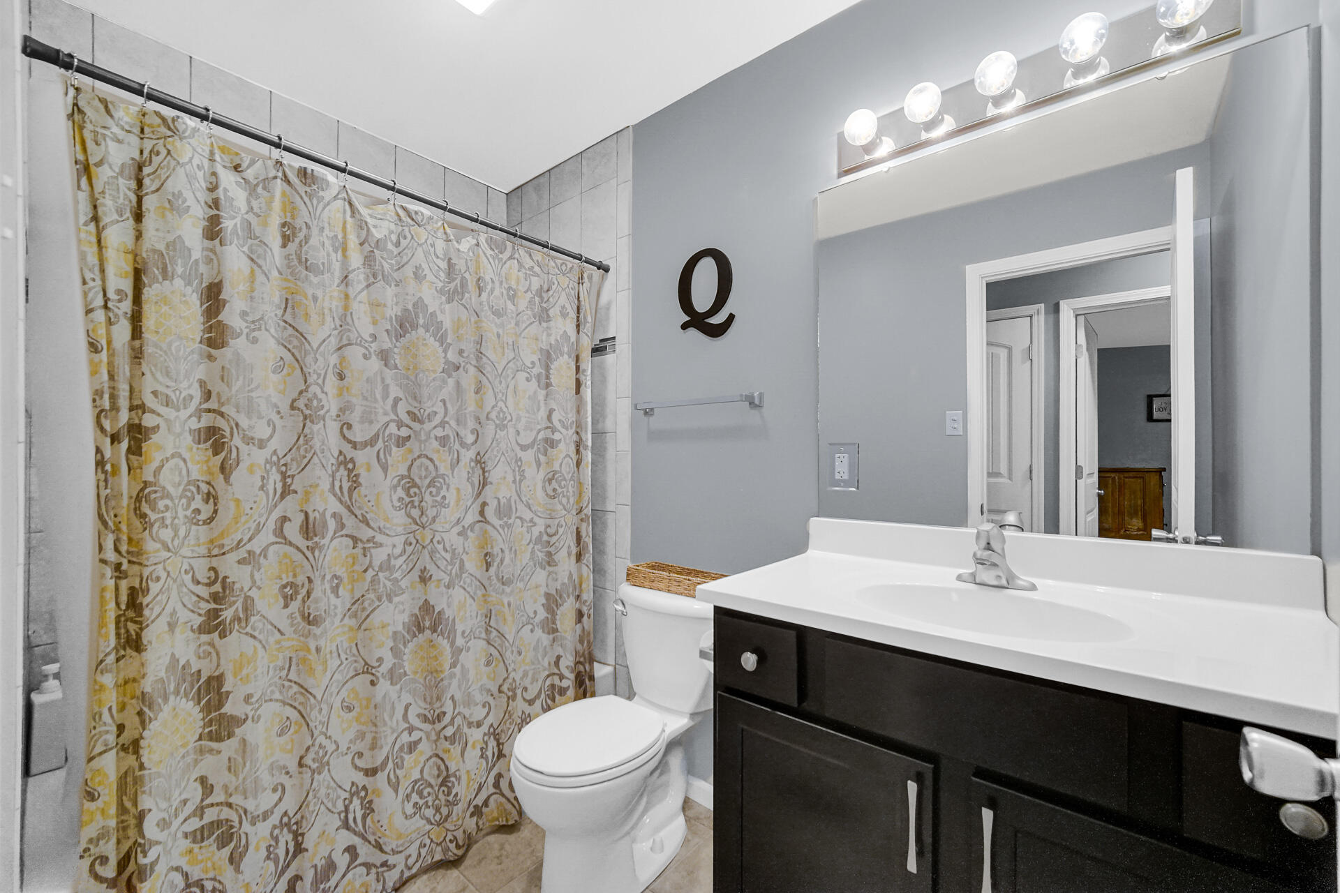 705 Juniper Road Valparaiso, IN 46385 - Photo 9 of 21 a bathroom with a sink and a mirror