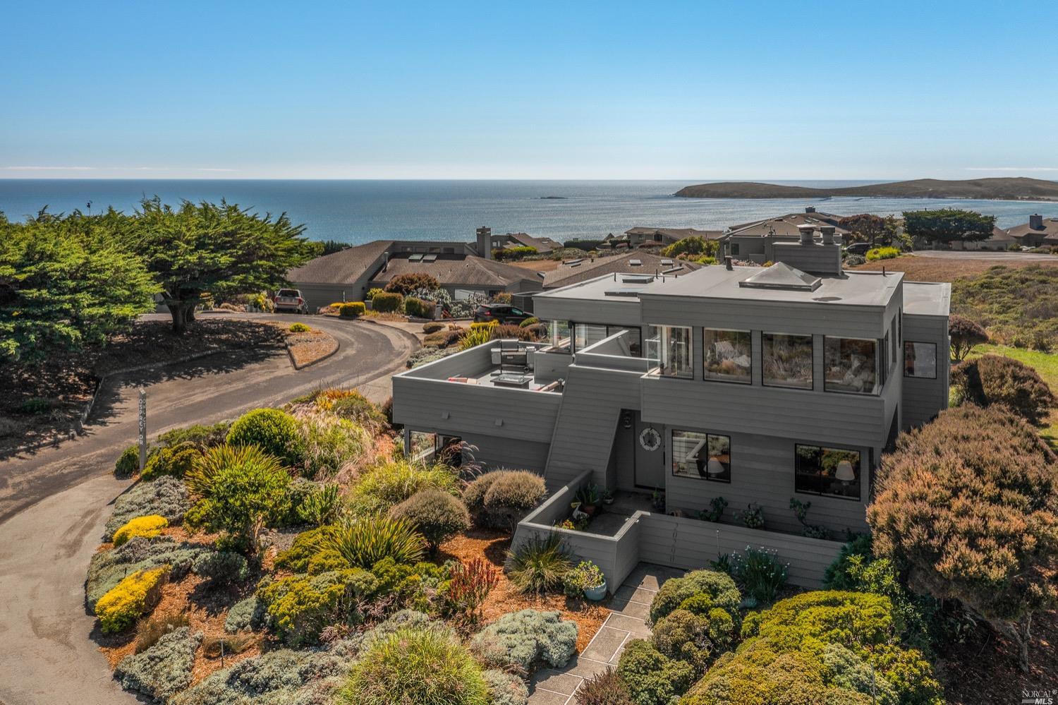 an aerial view of a house with a yard basket ball court and outdoor seating