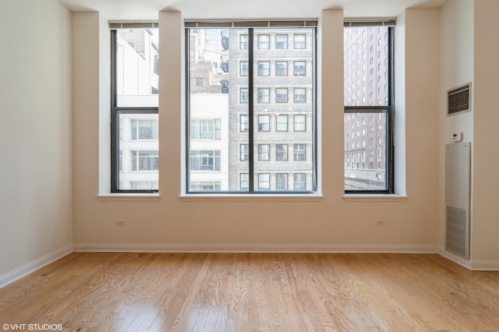 8 West Monroe Street, Unit 705 Chicago, IL 60603 - Photo 5 of 10 a view of an empty room with a window