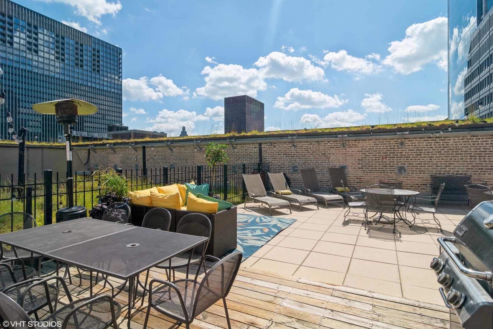 8 West Monroe Street, Unit 705 Chicago, IL 60603 - Photo 8 of 10 a view of a patio with table and chairs and potted plants