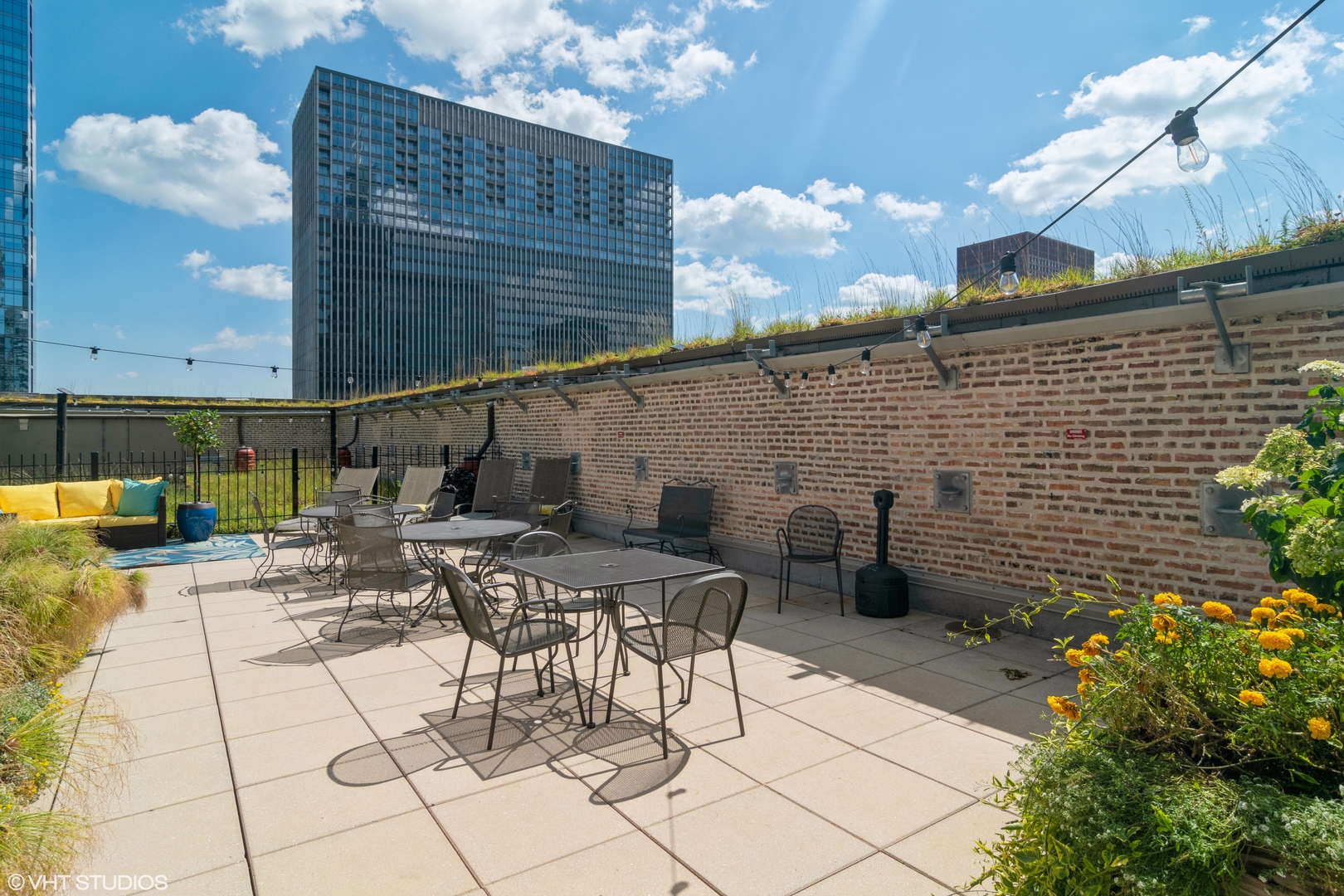 8 West Monroe Street, Unit 705 Chicago, IL 60603 - Photo 9 of 10 a view of a patio with table and chairs and potted plants