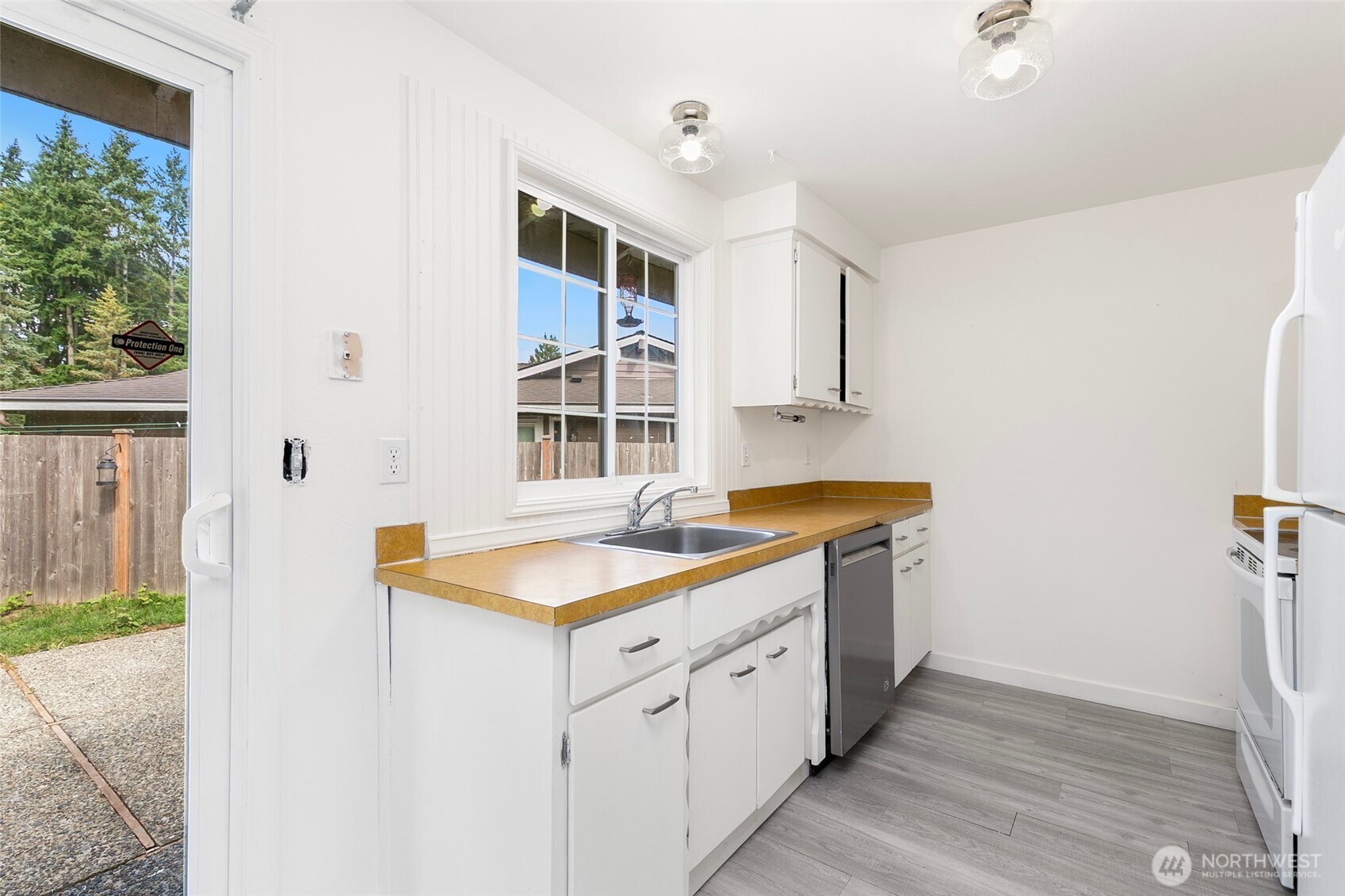 15028 108th Place Northeast Bothell, WA 98011 - Photo 12 of 26 a spacious bathroom with a granite countertop sink and a window
