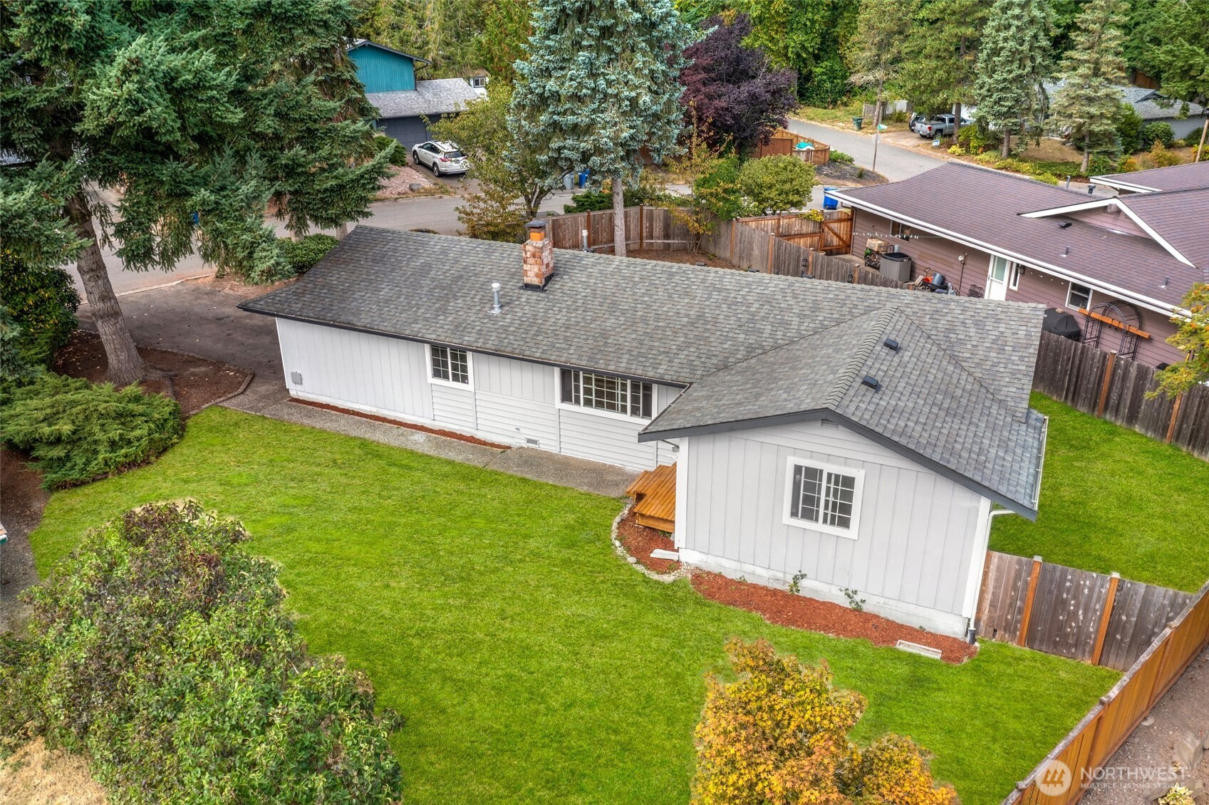 15028 108th Place Northeast Bothell, WA 98011 - Photo 2 of 26 a aerial view of a house with a yard and a large tree