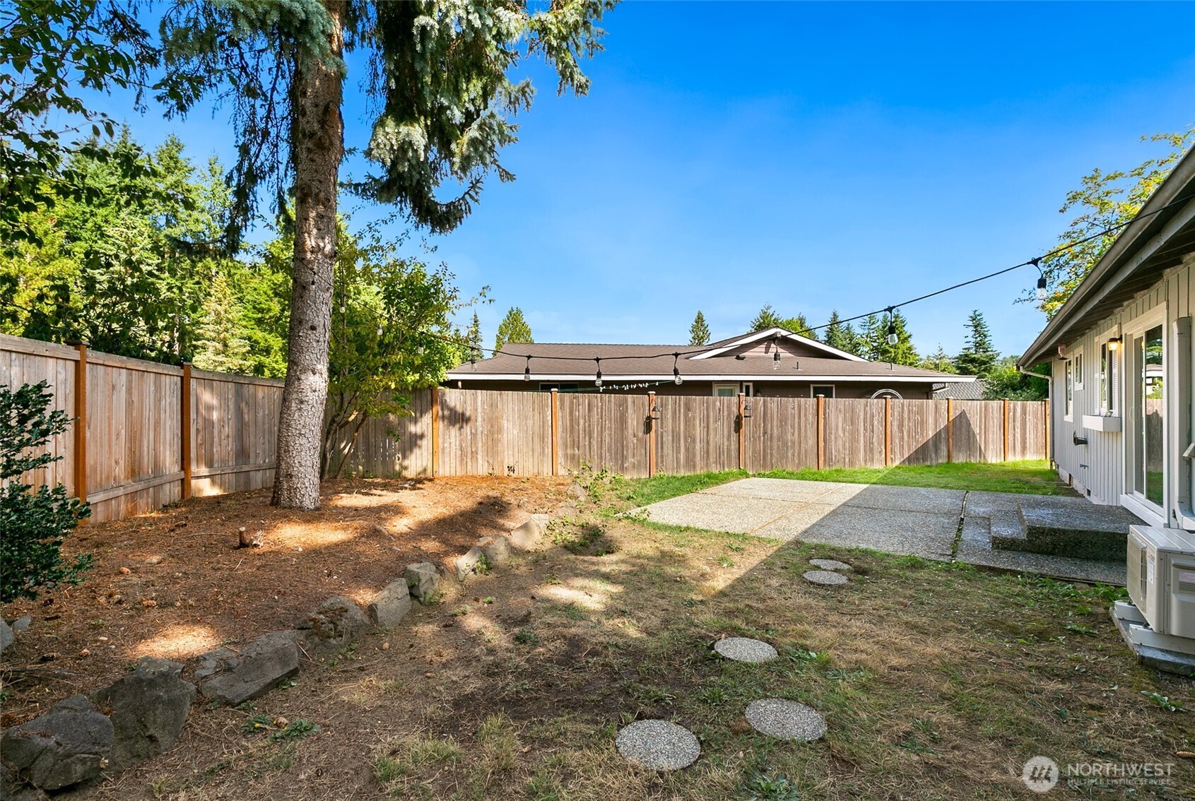 15028 108th Place Northeast Bothell, WA 98011 - Photo 22 of 26 a view of a yard with wooden fence
