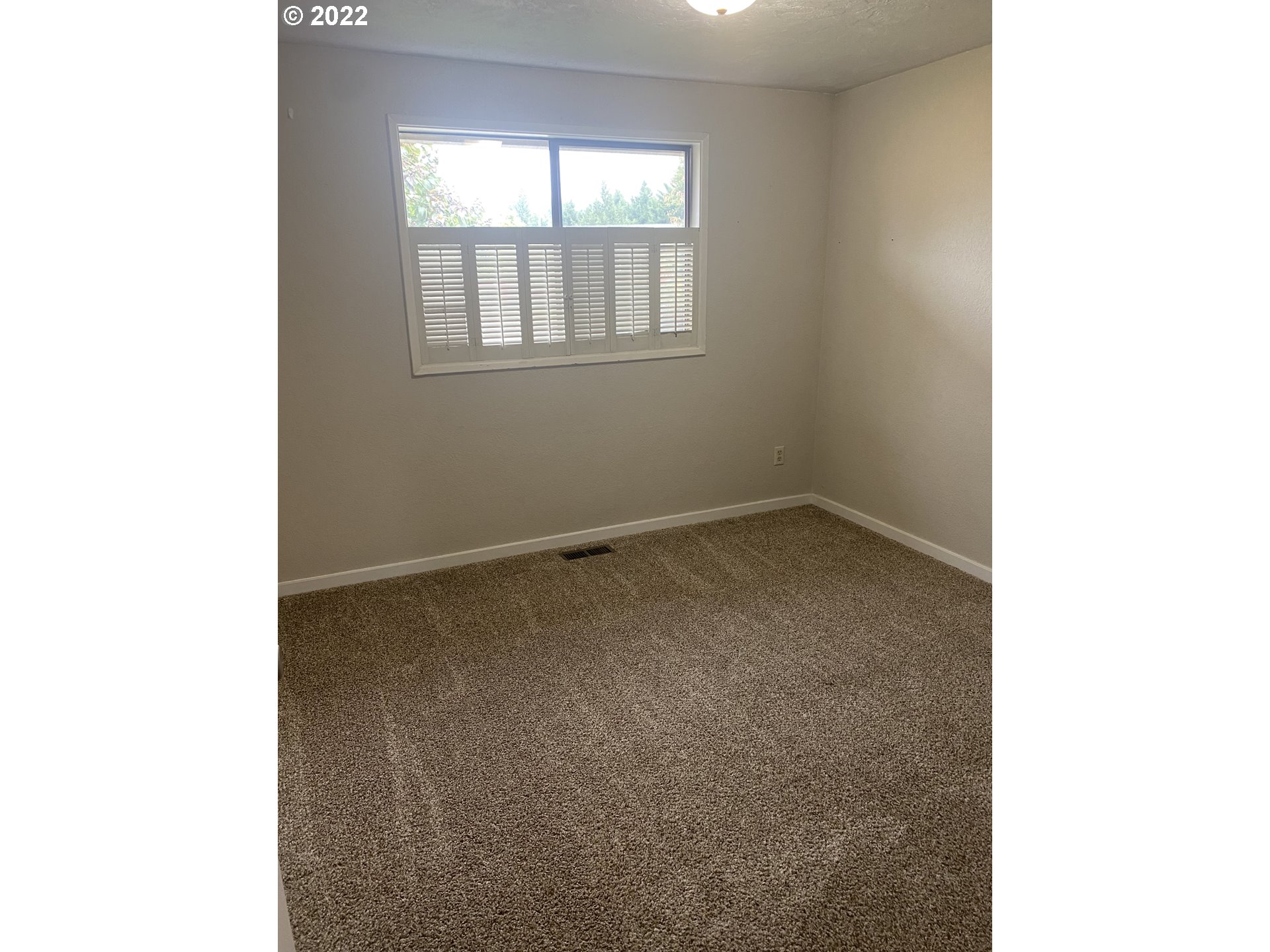 1023 65th Street Springfield, OR 97478 - Photo 15 of 23 a view of an empty room with a window