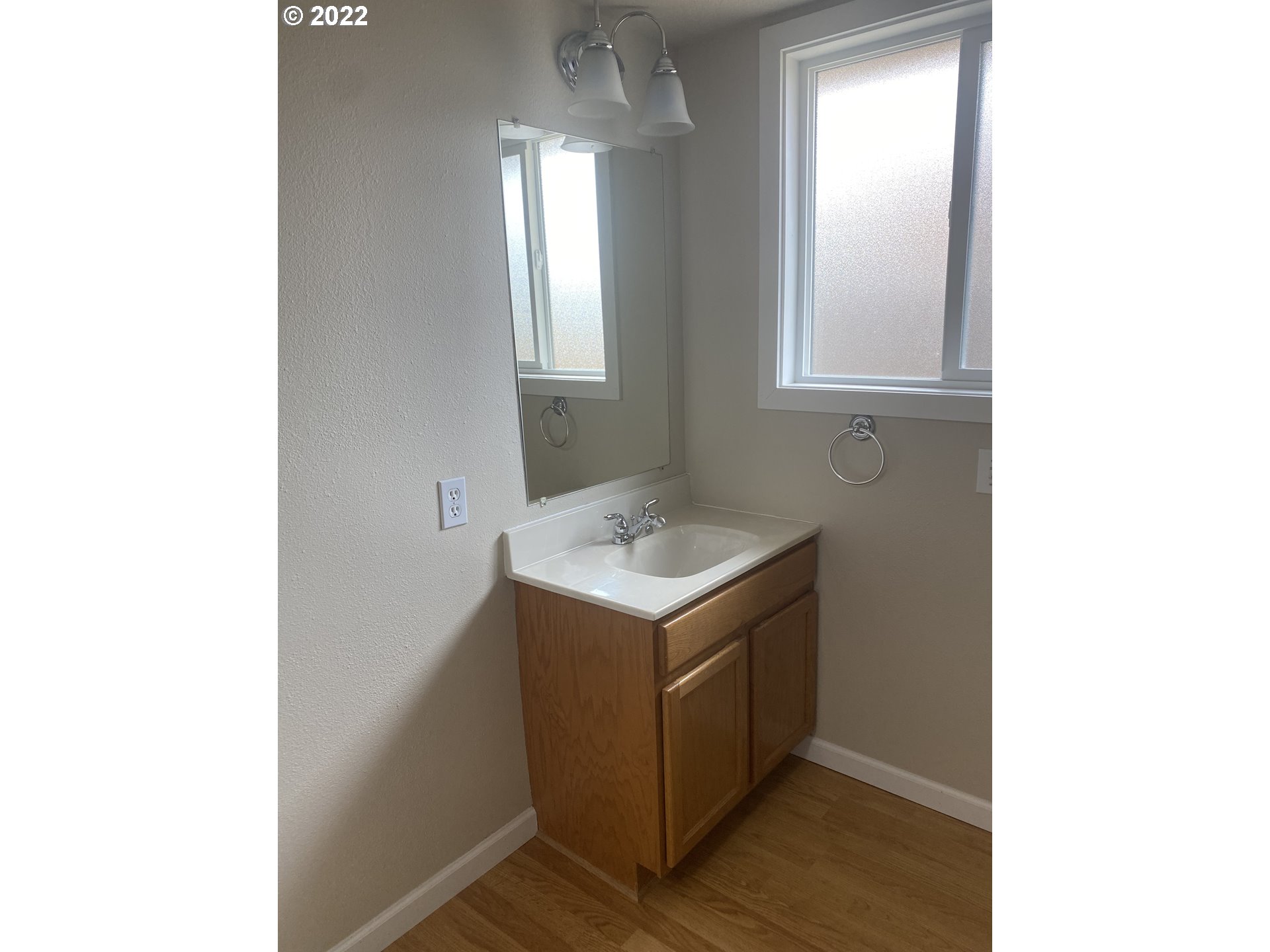 1023 65th Street Springfield, OR 97478 - Photo 19 of 23 a bathroom with a sink and a mirror