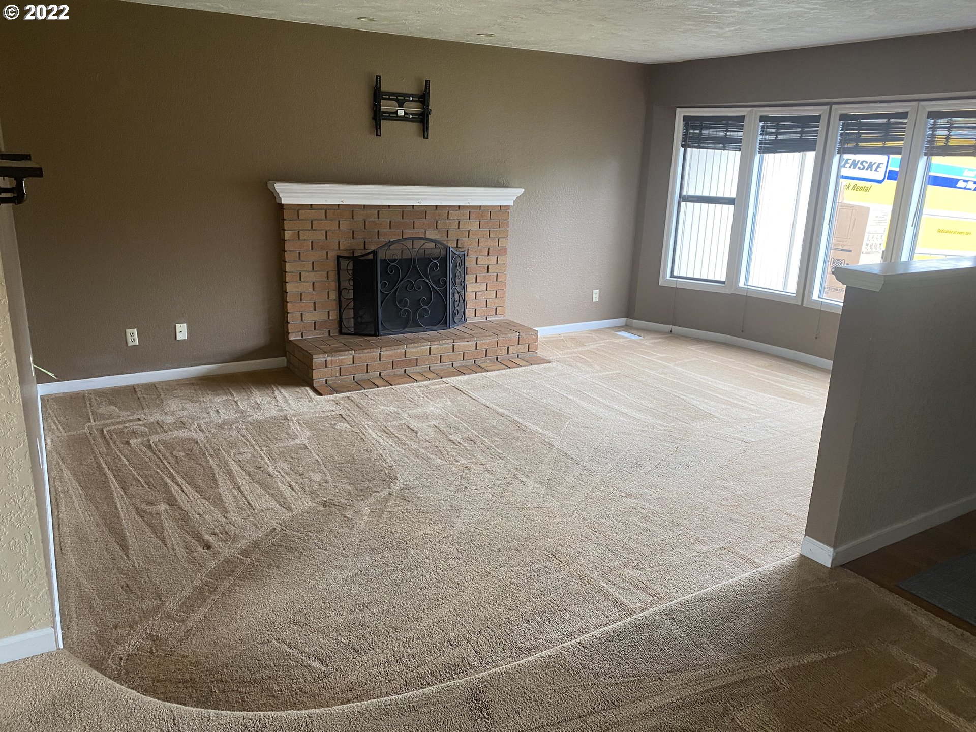 1023 65th Street Springfield, OR 97478 - Photo 2 of 23 a view of empty room with fireplace