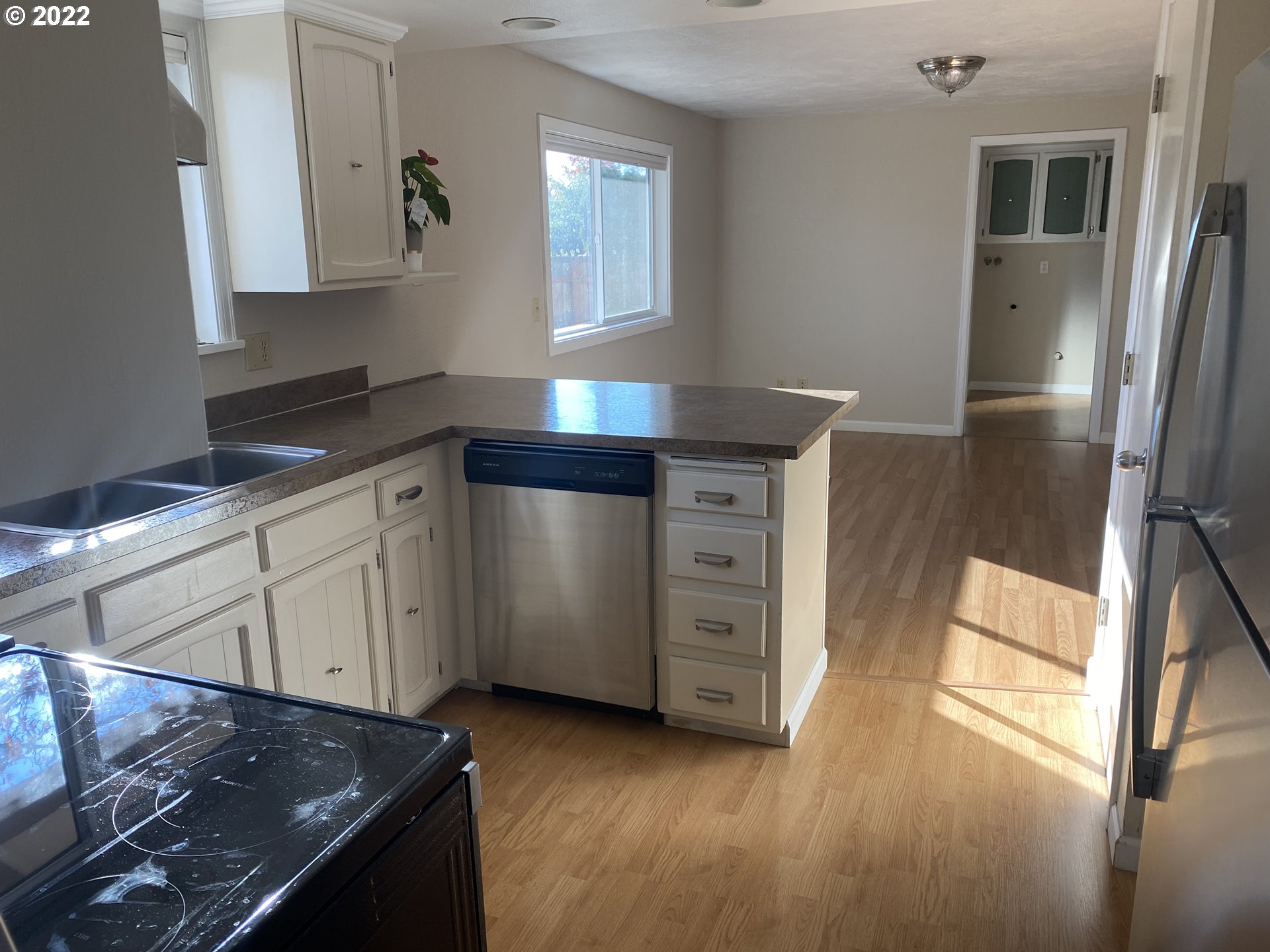 1023 65th Street Springfield, OR 97478 - Photo 9 of 23 a kitchen with a stove and a refrigerator