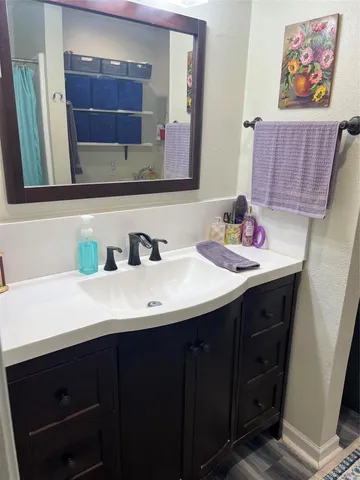 a bathroom with a sink and a mirror