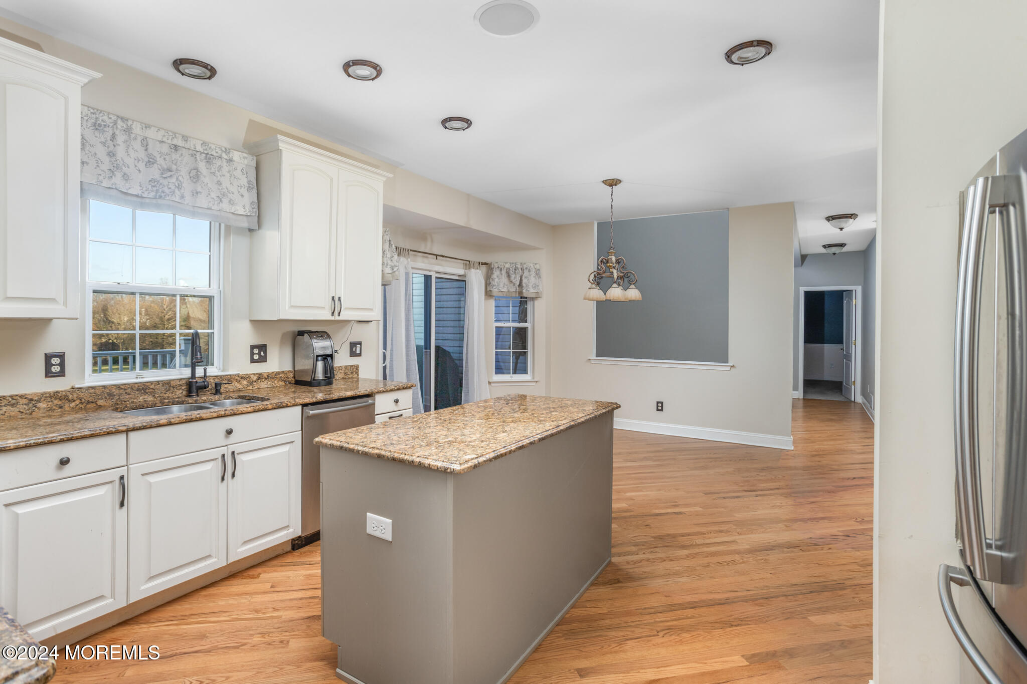 115 Holmes Mill Road Cream Ridge, NJ 08514 - Photo 11 of 49 a large kitchen with stainless steel appliances granite countertop a sink and dishwasher with white cabinets