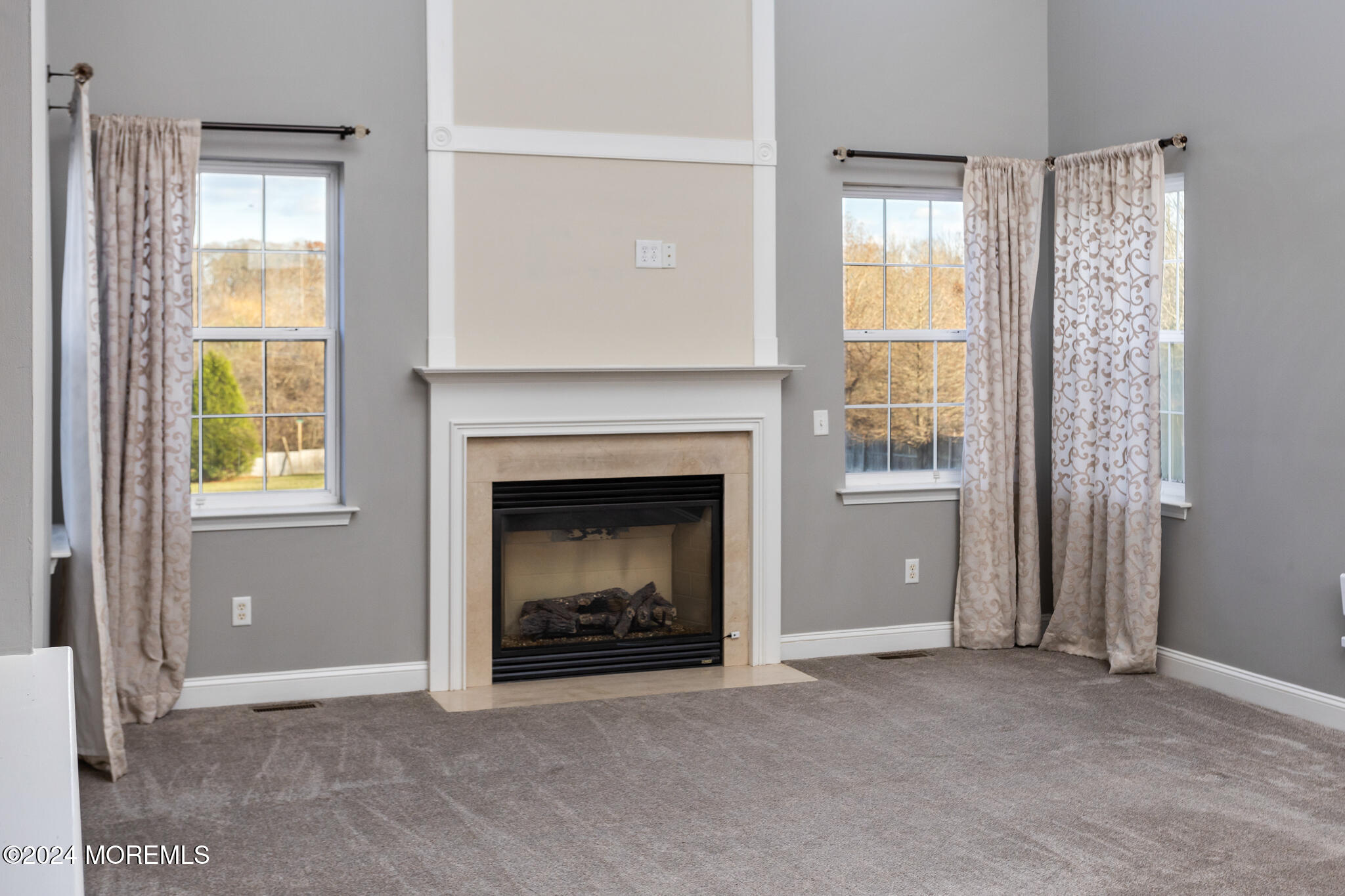 115 Holmes Mill Road Cream Ridge, NJ 08514 - Photo 15 of 49 a view of an empty room with a fireplace and a window