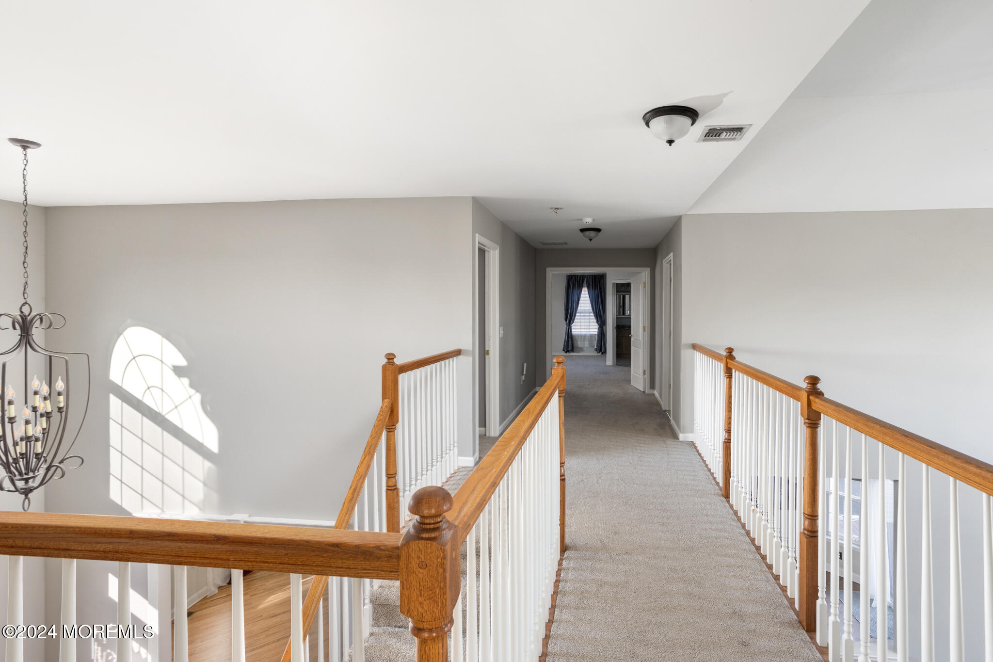 115 Holmes Mill Road Cream Ridge, NJ 08514 - Photo 22 of 49 a view of a hallway with wooden floor and stairs