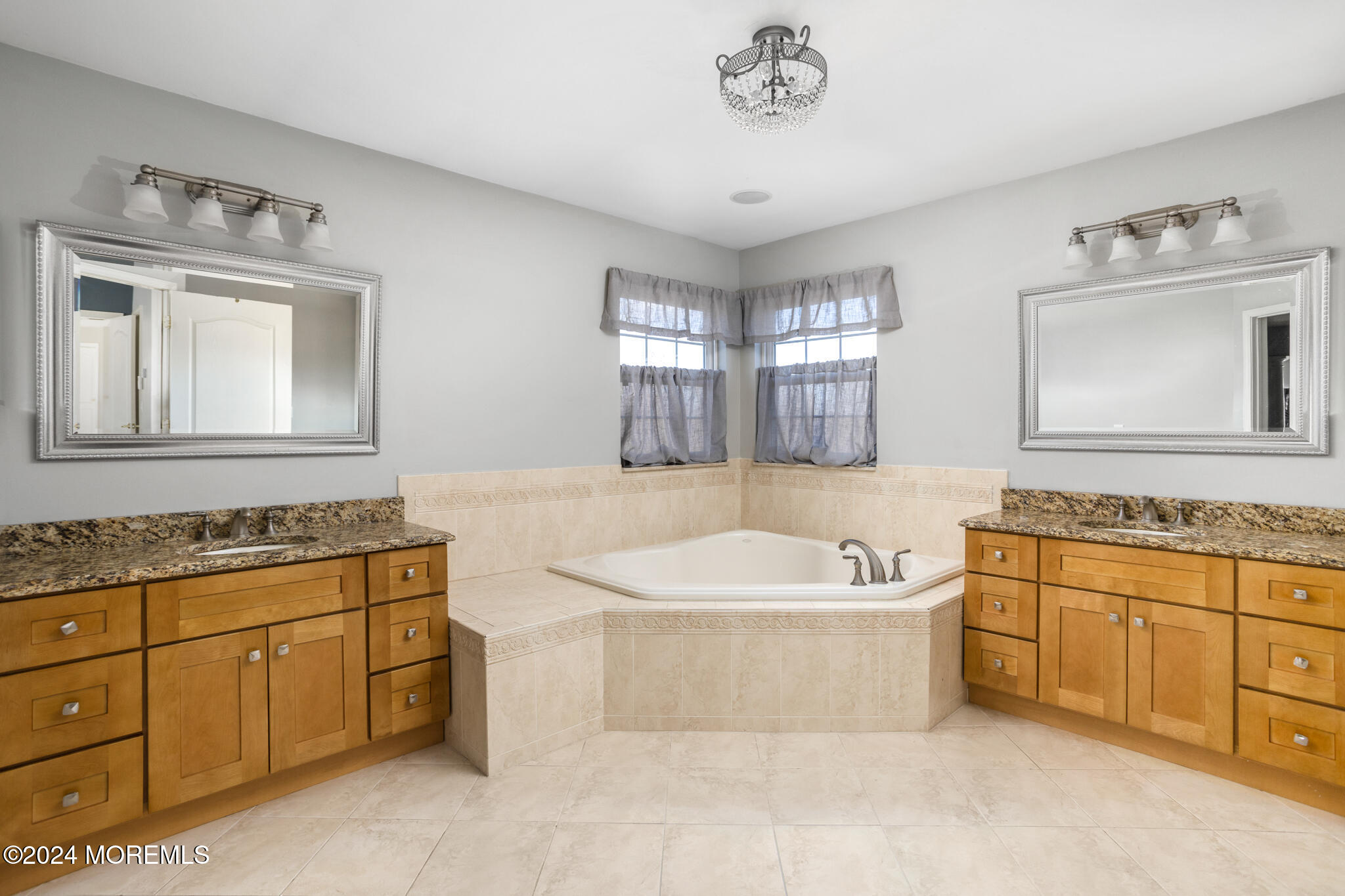 115 Holmes Mill Road Cream Ridge, NJ 08514 - Photo 25 of 49 a bathroom with a double vanity sink a mirror and a bathtub