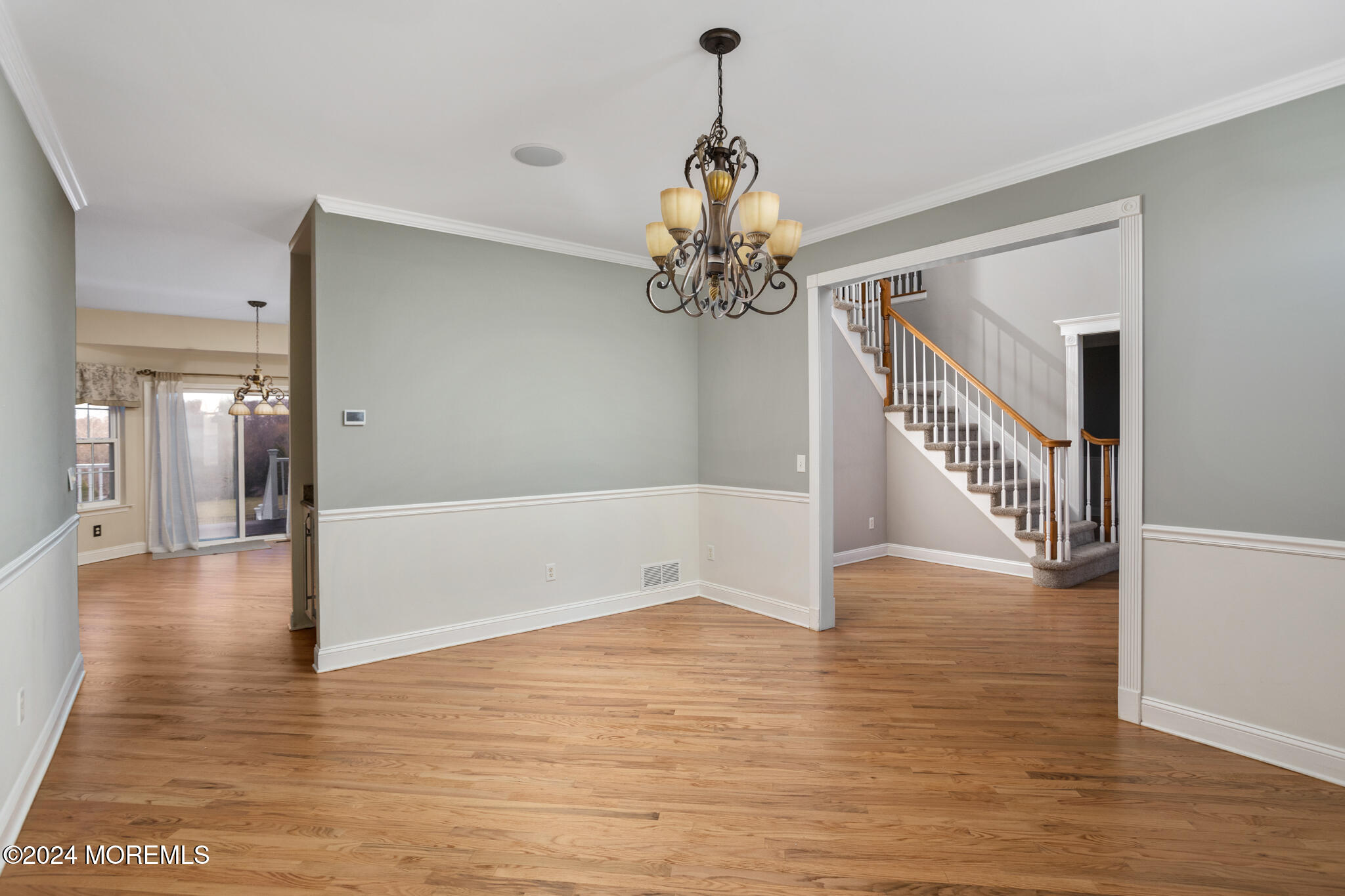 115 Holmes Mill Road Cream Ridge, NJ 08514 - Photo 7 of 49 a view of a hallway with wooden floor and staircase