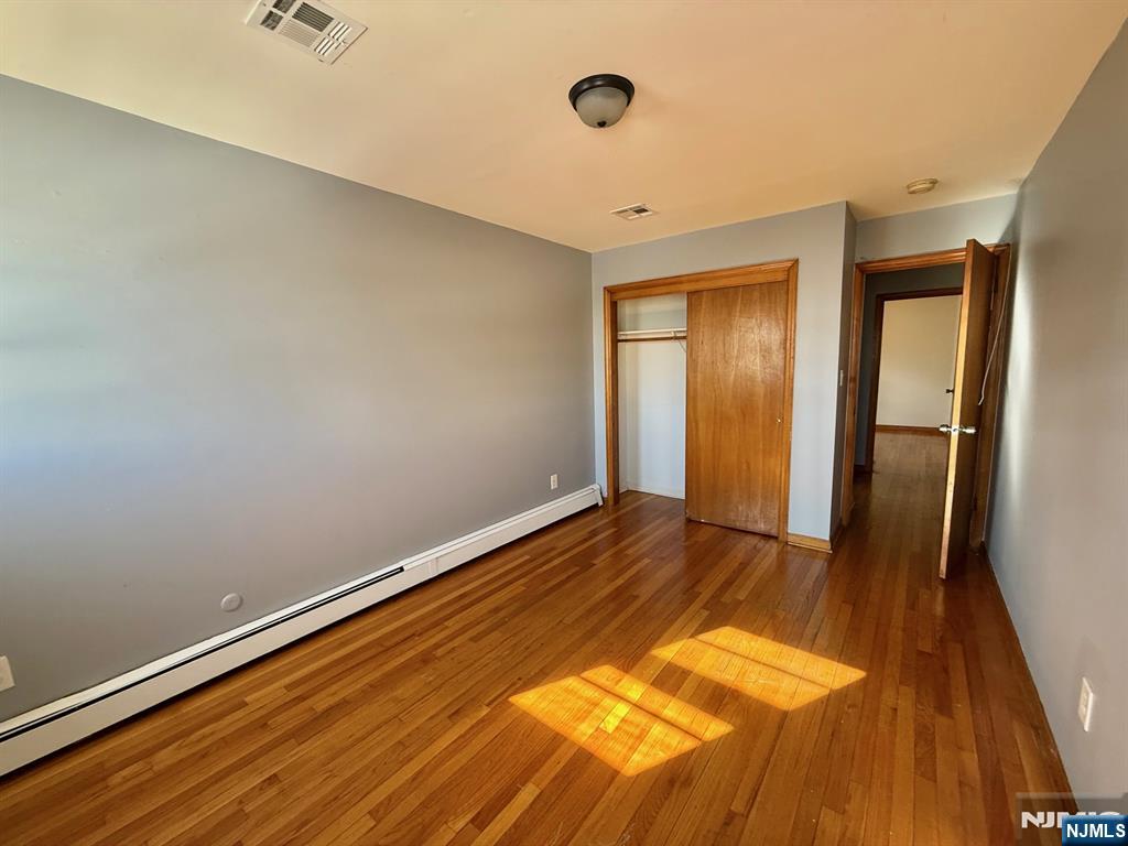 749 Cleveland Avenue, Unit 2 Harrison, NJ 07029 - Photo 14 of 16 a view of empty room with wooden floor