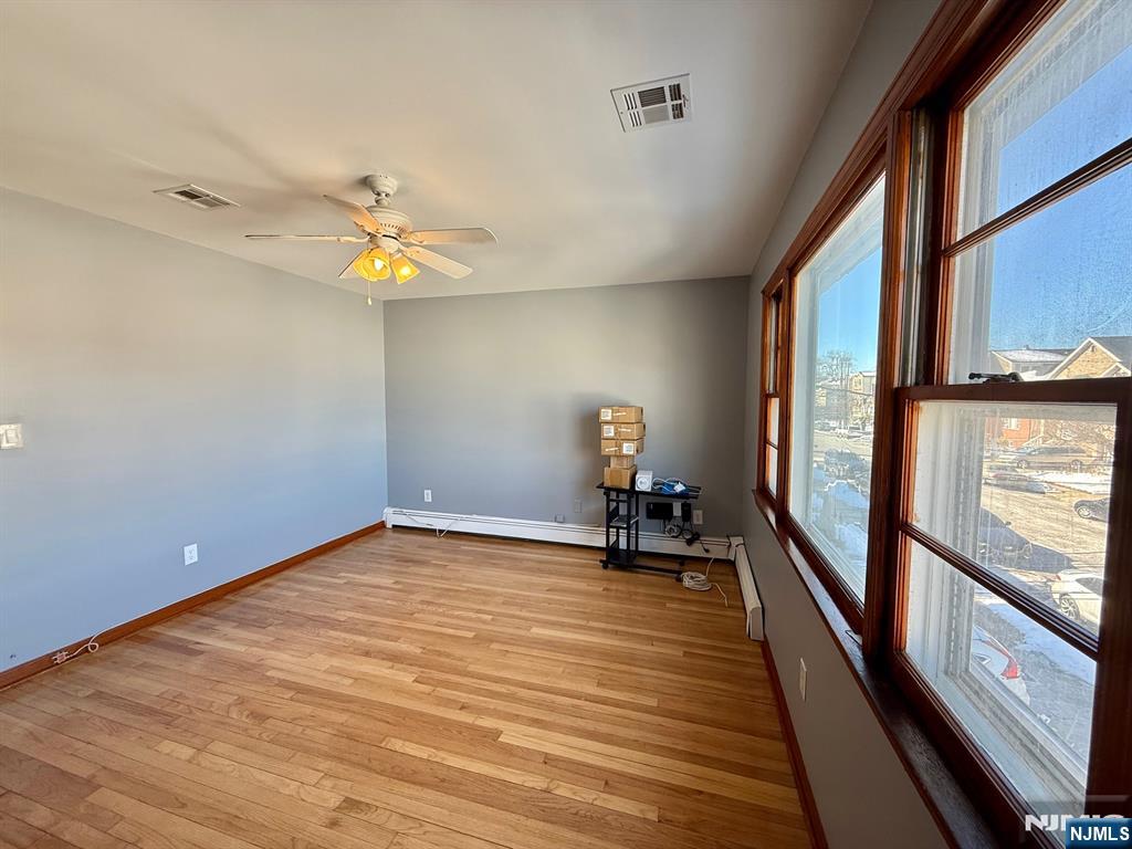 749 Cleveland Avenue, Unit 2 Harrison, NJ 07029 - Photo 7 of 16 a view of an empty room and a window