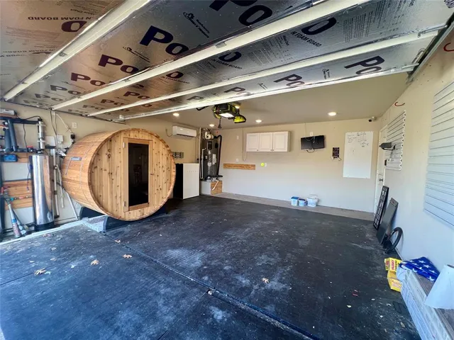 a large kitchen with a stove a sink dishwasher and a refrigerator