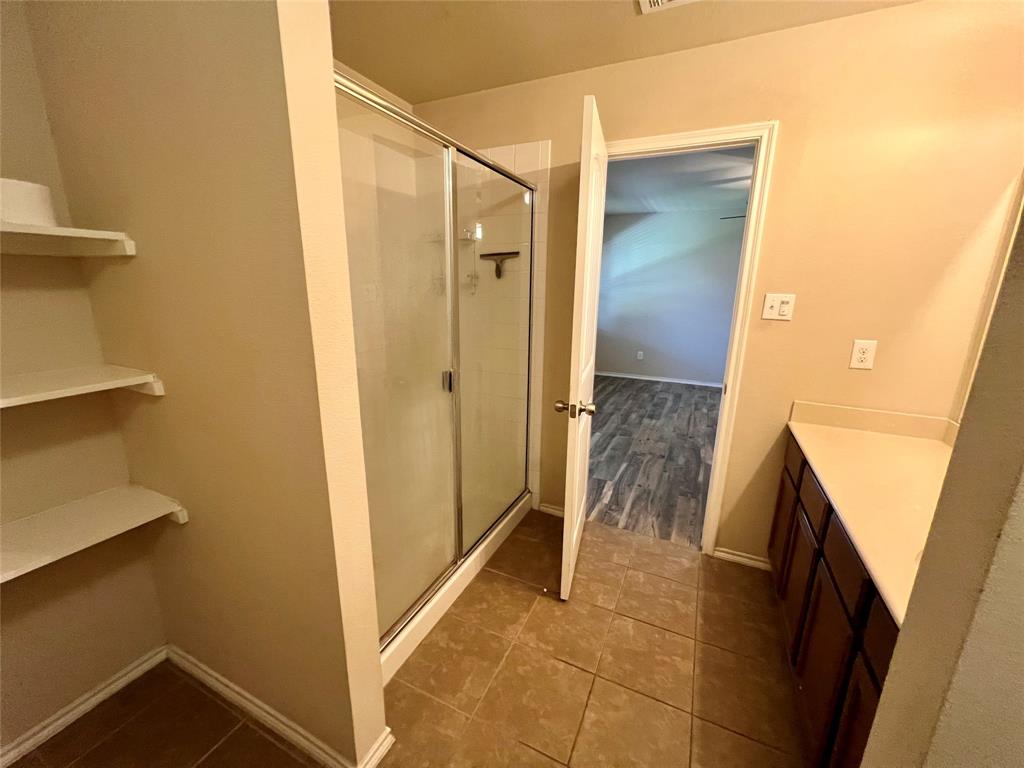 484 Harding Lane Lavon, TX 75166 - Photo 26 of 38 a bathroom with a shower and a sink