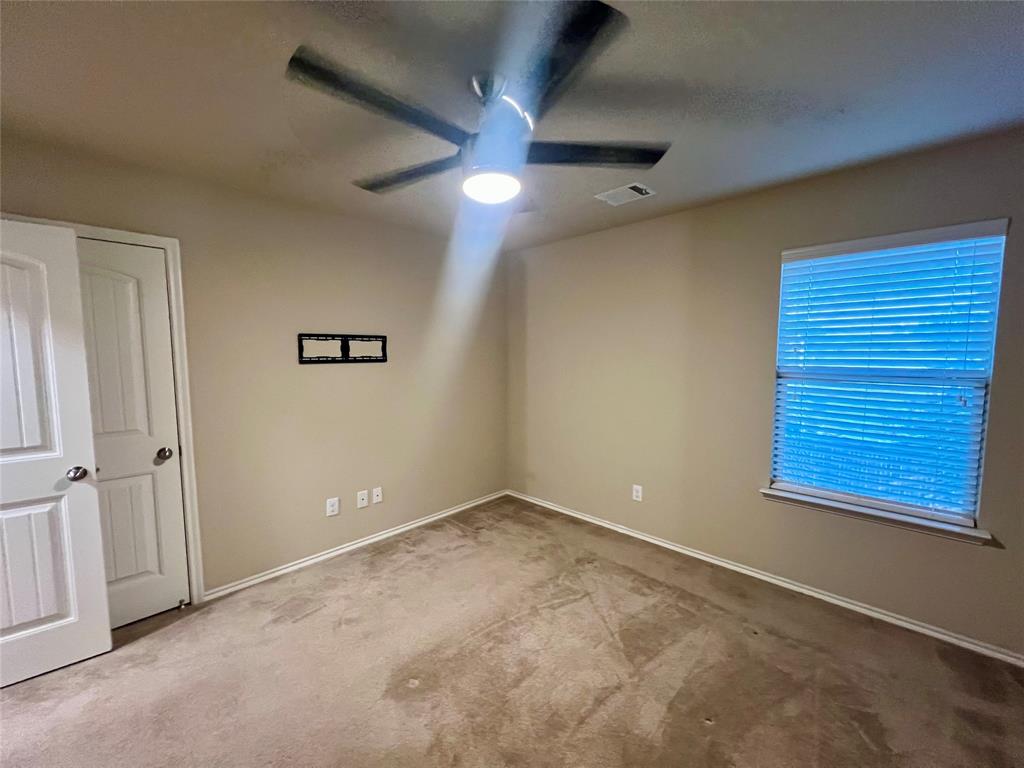 484 Harding Lane Lavon, TX 75166 - Photo 27 of 38 an empty room with windows and fan