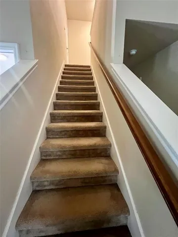 a bathroom with a shower and a sink