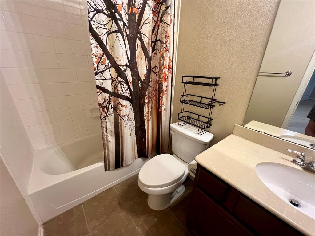 484 Harding Lane Lavon, TX 75166 - Photo 31 of 38 a bathroom with a sink toilet and shower
