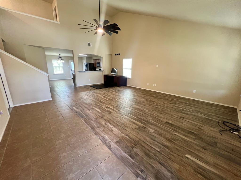 484 Harding Lane Lavon, TX 75166 - Photo 7 of 38 wooden floor in an empty room with a window
