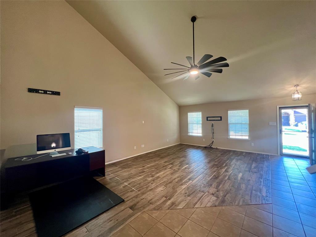 484 Harding Lane Lavon, TX 75166 - Photo 8 of 38 a view of a workspace with furniture and a ceiling fan
