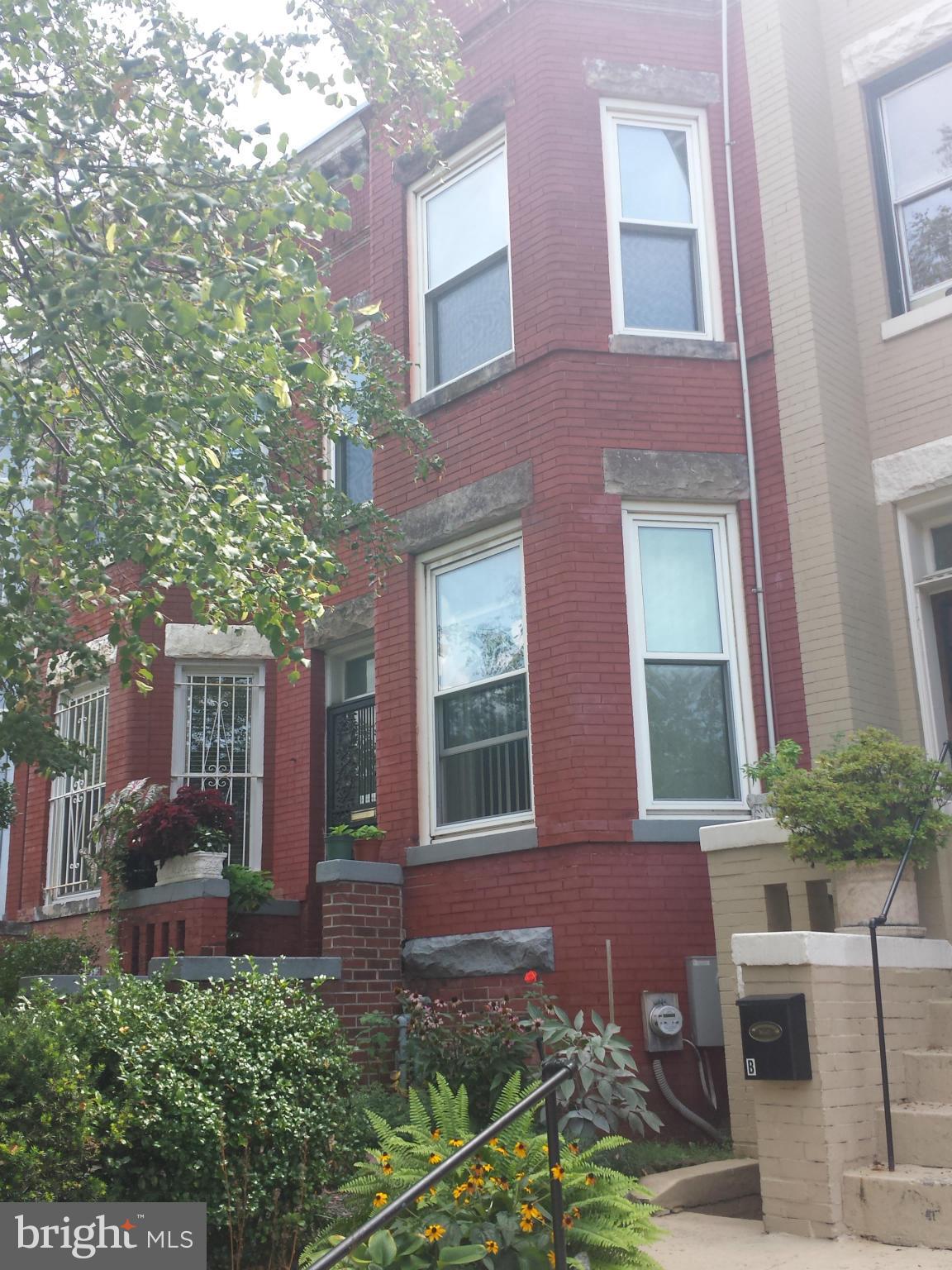 43 R Street Northeast Washington, DC 20002 - Photo 1 of 1 a view of a brick building next to a yard