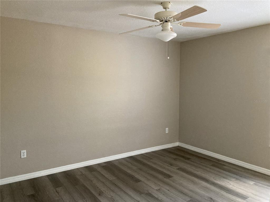 1088 Nomad Road Punta Gorda, FL 33983 - Photo 5 of 13 a view of an empty room with wooden floor