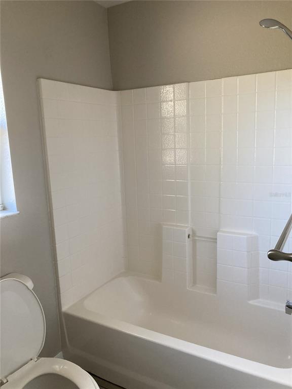 1088 Nomad Road Punta Gorda, FL 33983 - Photo 8 of 13 a bathroom with a bathtub and toilet