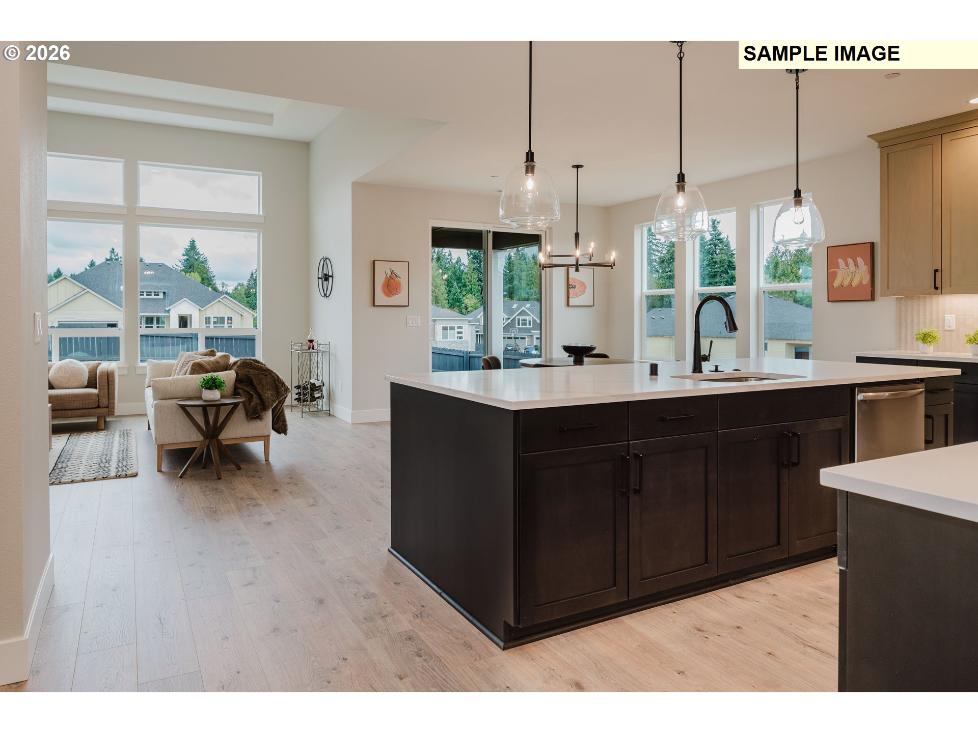 1403 North 41st Place Ridgefield, WA 98642 - Photo 4 of 30 a kitchen with a sink counter top space and living room view