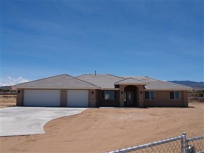 5225 Cambria Road Phelan, CA 92371 - Photo 1 of 1 Beautiful appeal. Elegant Design: covered porch with portico. Large concrete drive with 3-Car attached garage.