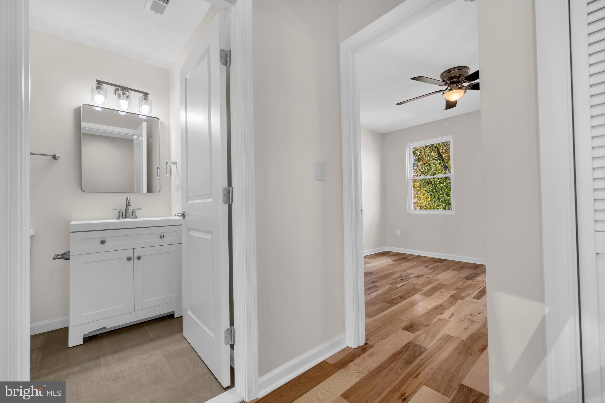 1626 Hazel Street Curtis Bay, MD 21226 - Photo 11 of 24 a bathroom with a toilet sink and mirror