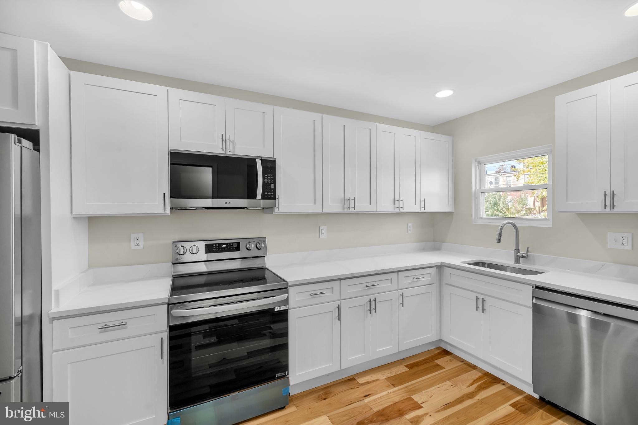 1626 Hazel Street Curtis Bay, MD 21226 - Photo 9 of 24 a kitchen with stainless steel appliances granite countertop a sink and cabinets
