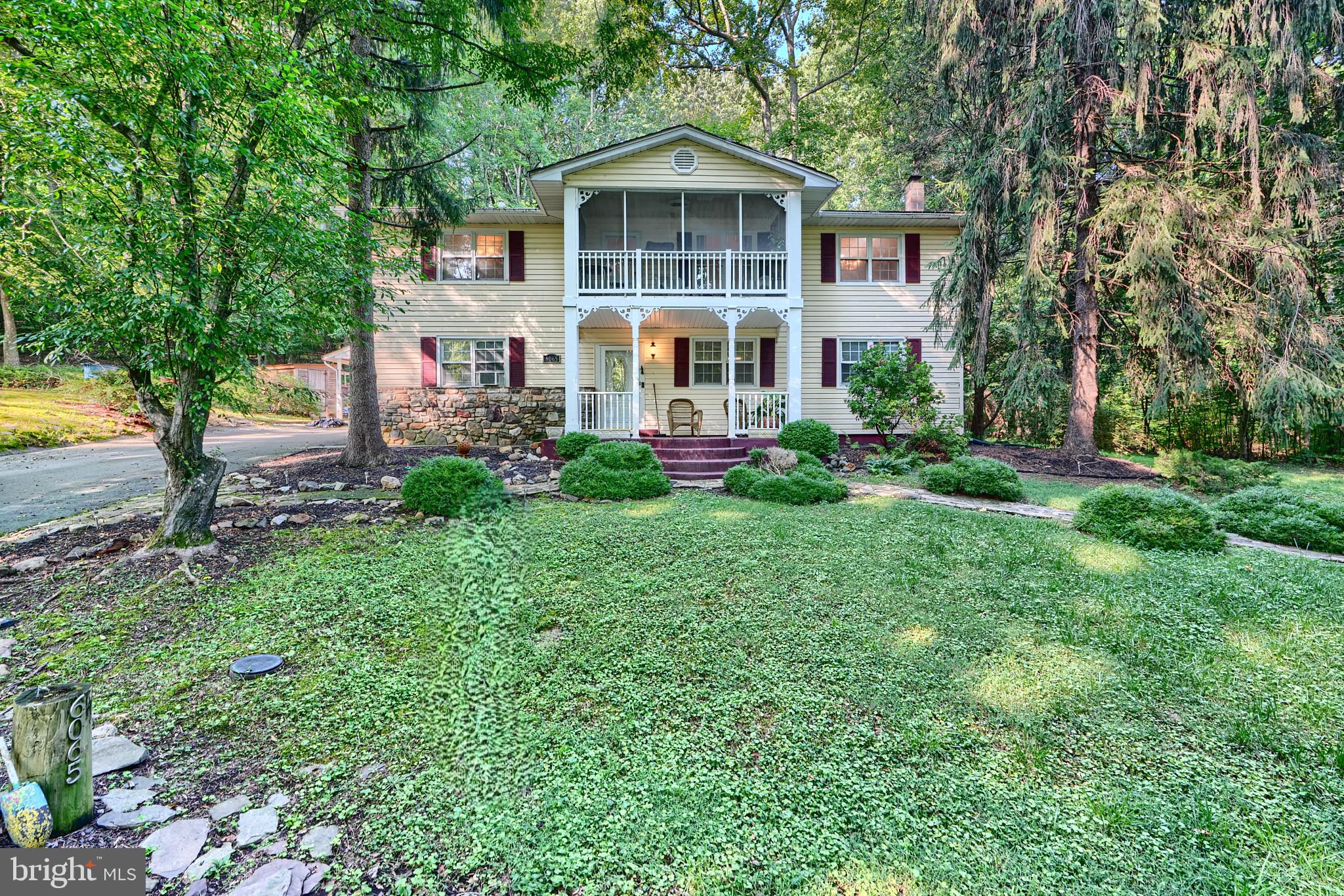 6065 Poplar Road St. Leonard, MD 20685 - Photo 2 of 50 a house view with a garden space