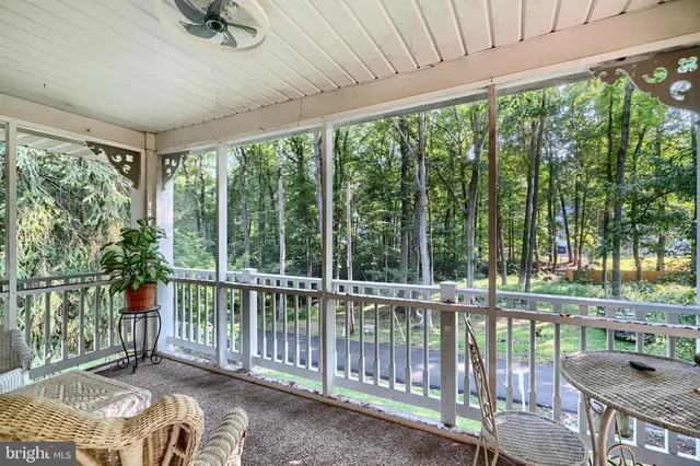 a view of a backyard with floor to ceiling window and outdoor space