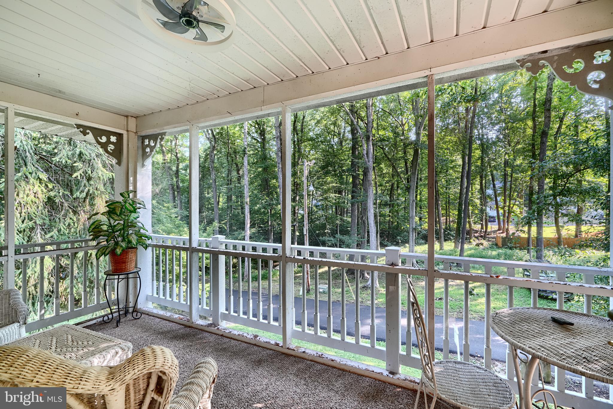 6065 Poplar Road St. Leonard, MD 20685 - Photo 24 of 50 a view of a backyard with floor to ceiling window and outdoor space