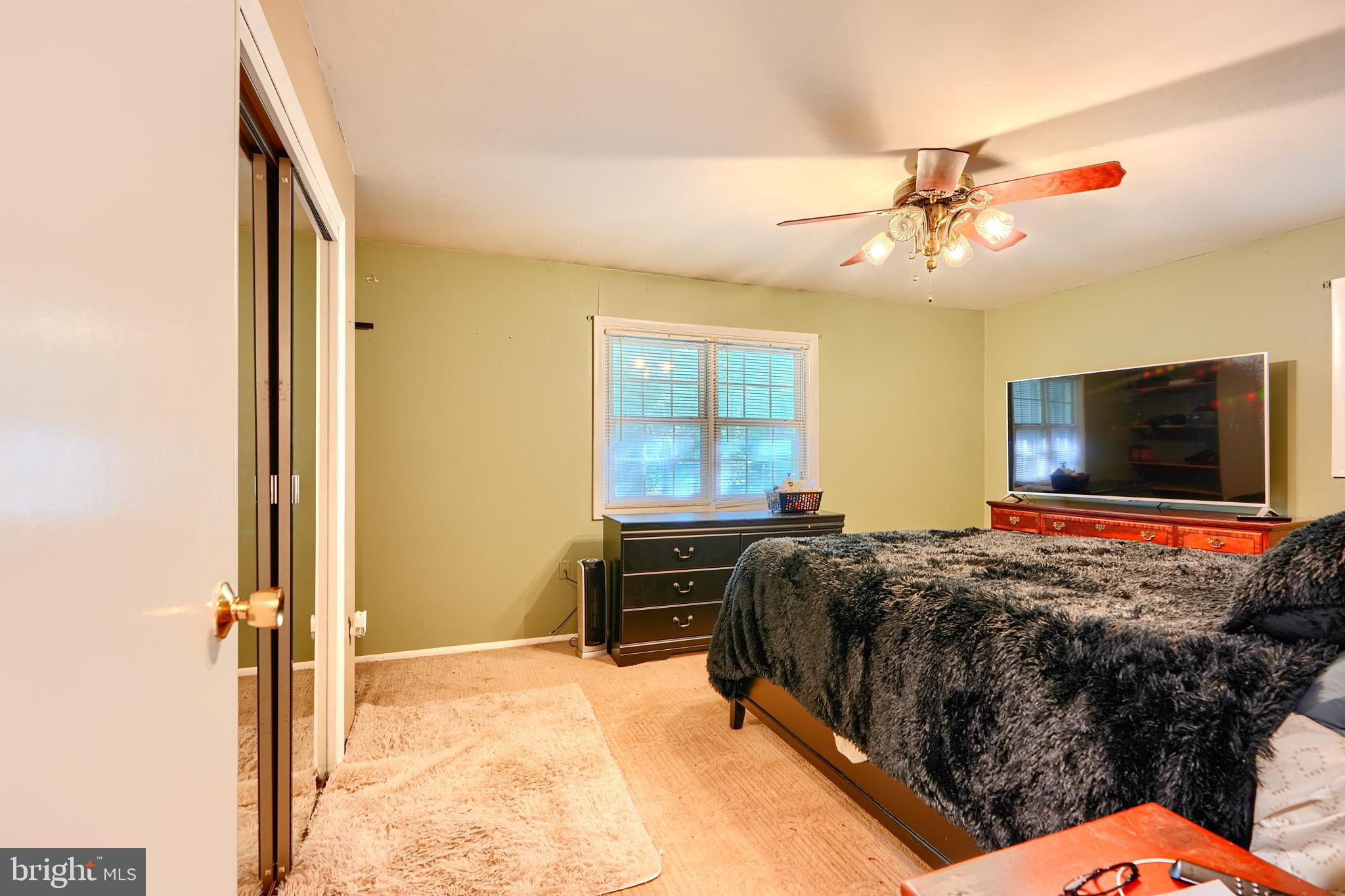 6065 Poplar Road St. Leonard, MD 20685 - Photo 26 of 50 a bed room with a bed television and a window
