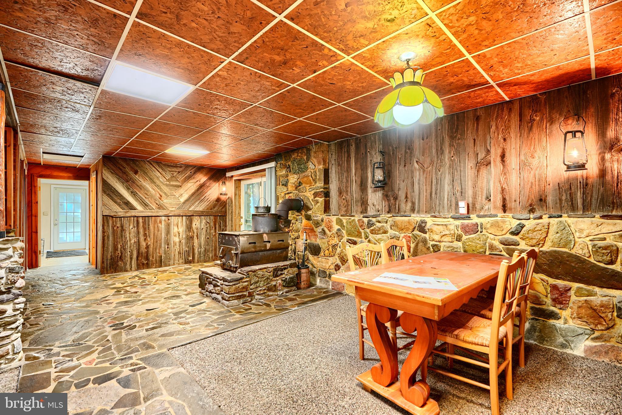 6065 Poplar Road St. Leonard, MD 20685 - Photo 41 of 50 a view of a patio with a table and chairs